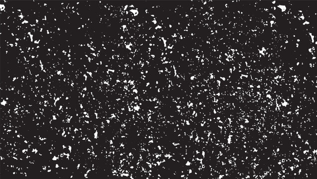 Abstract black and white texture with scattered irregular bright spots