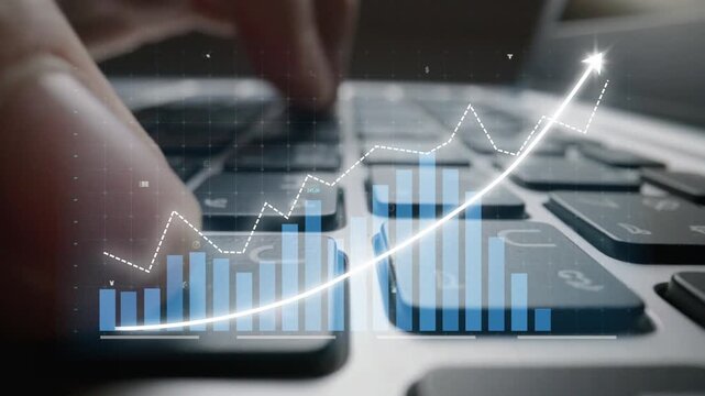A close-up image captures a finger typing on a laptop keyboard, complemented by an overlay of financial charts and graphs showcasing market trends and data analysis. Copula