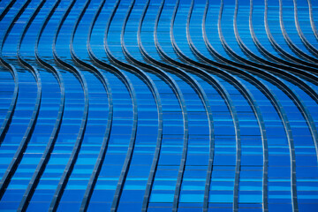Naklejka premium Glass wall curve Architecture details Modern building Exterior Blue color reflection