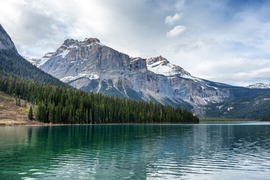 Turquoise water of Emerald Lake reflecting Canadian Rockies mountains