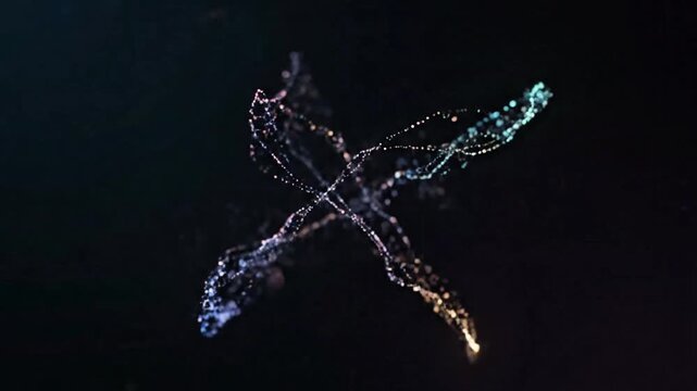 A dragonfly flies with illuminated wings in the dark night sky.