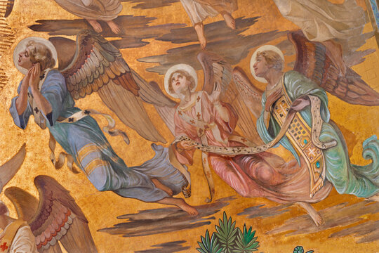 MONZA, ITALY - MARCH 19, 2026: The fresco of angel adorated Jesus the Pantokrator in main apse of the church Chiesa di San Carlo by Grandi from year 1925.