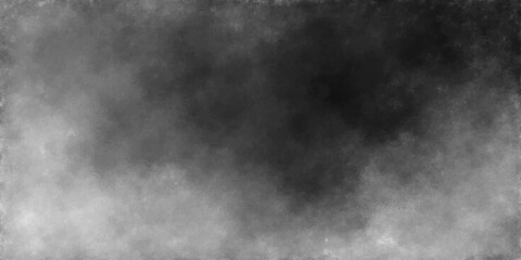 Fototapeta premium An abstract black and white background featuring dark smoke and misty clouds moving through a textured night sky