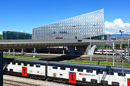 Geneva, Switzerland, Europe - 05.08.2026 : Stadler KISS and fast Stadler SMILE - Swiss electric unit trains, headquarters of JTI - Japan Tobacco International, WMO - World Meteorological Organization