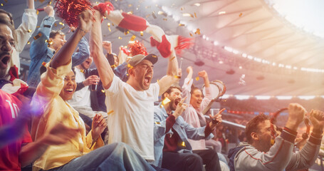 Naklejka premium Diverse Soccer Supporters Surge Upright in Stadium Seats During a Football Championship, Shouting in Disbelief, Relief and Victory While a Red Scarf Swings, a Tambourine Shakes and Confetti Falls.