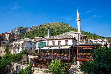 Obraz premium Historical Nezir Aga mosque and traditional stone houses in old town of Mostar, Bosnia and Herzegovina