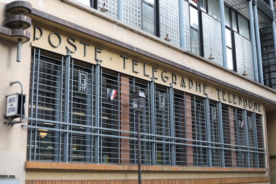  Paris, France - April 9, 2026. A close-up of the unusual facade of a Parisian post office located near Bastille. 