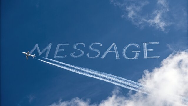 Airplane Writing Message in Blue Sky with White Clouds and Contrails, Aviation Communication and Skywriting Concept