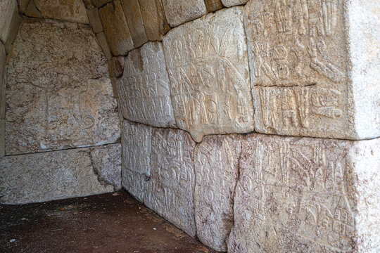 Interior view of the vaulted stone Chamber 2 (Hieroglyph Chamber) at the Southern Citadel of Hattusa. The stone walls feature low-relief carvings of King Suppiluliuma II and extensive Luwian hieroglyp
