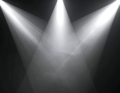 Stage lights shining down on darkness.