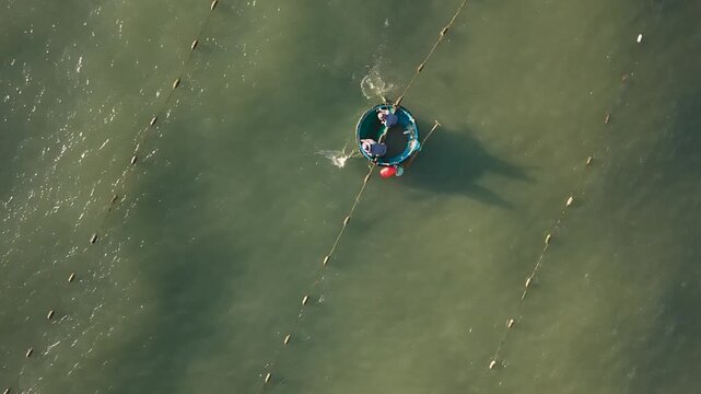 Aerial Video Fisherman Setting Nets from Boat Vietnam Shoreline