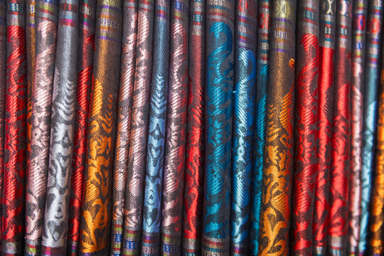 background with colorfull asian silk fabric, scarves tapestry