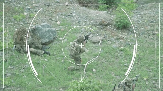 Soldiers practice target shooting in a forest area during day training