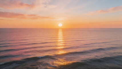 Obraz premium Sunset over ocean with calm waves symbolizing tranquility, harmony, and natural balance