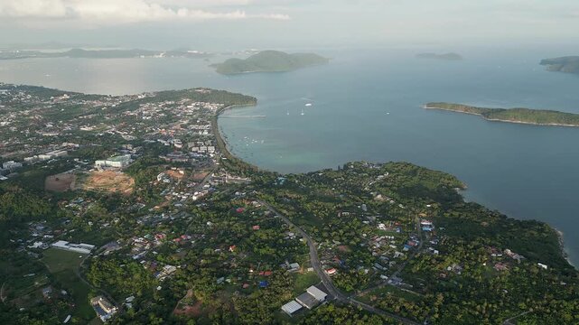 Fast aerial pan across southern tip of Phuket island in Thailand