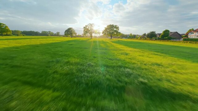 FPV drone flight through a rural field