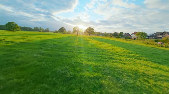 FPV drone flight through a rural field