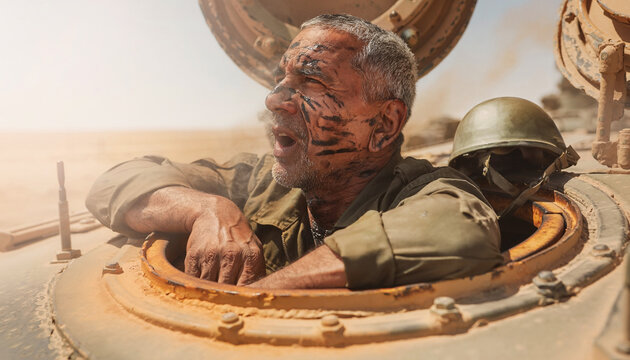 Egyptian armored vehicle commander leans out of tank hatch during operations in desert sunlight, focused on surroundings