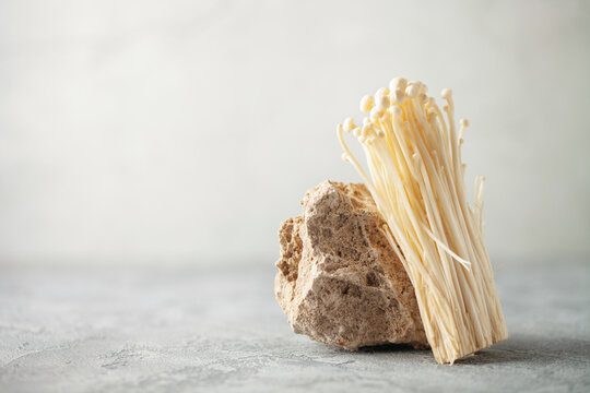 Popular in asian cuisine fresh golden needle mushroom or enoki, enokitake (Flammulina velutipes)