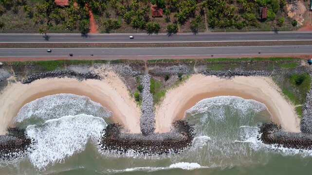 Scenic Aerial View of NH 66 Coastal Highway Running Along Seaside Landscape with Moving Traffic, Ocean Views, Modern Road Infrastructure, Beautiful Shoreline and Long Distance Transportation Route
