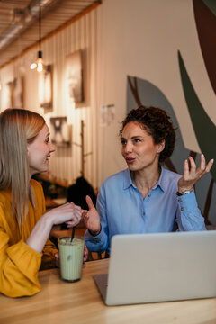 Women networking during business meeting at coffee shop