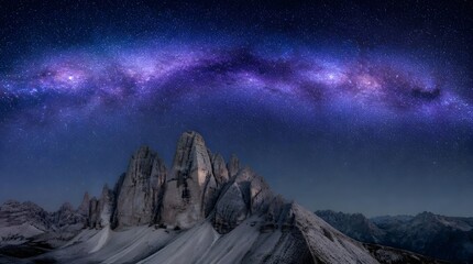 Obraz premium Milky Way galaxy arching over Tre Cime di Lavaredo mountain peaks at night.