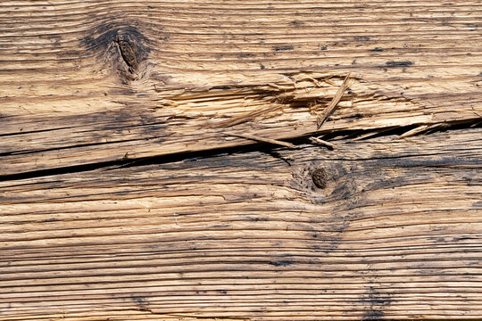 Damaged splintered old wooden board texture surface