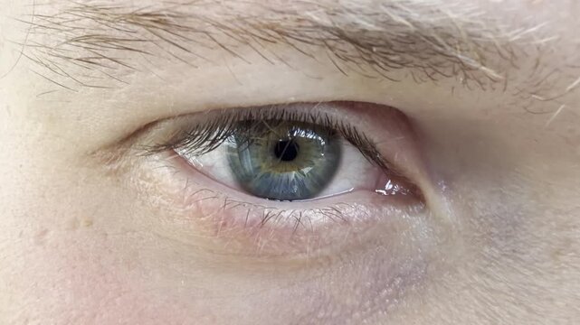 Close-up of a young man's open eye
