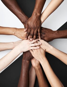 Diverse group of hands coming together in unity and support.