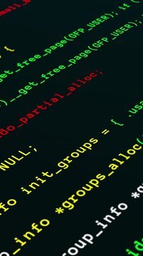 Dynamic close up angled portrait view of glowing green computer programming language script scrolling on a screen.