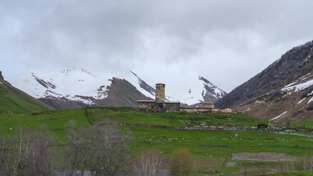 Day to night transition timelapse of the ancient Lamaria Church complex under moving clouds in Caucasus mountains, Georgia