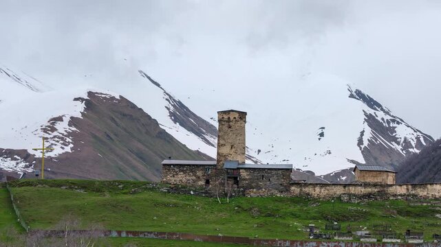 Day to night transition timelapse of the ancient Lamaria Church complex under moving clouds in Caucasus mountains, Georgia