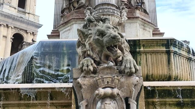 Stone Lion Statue and Water Cascade at Historical Fountain in Paris