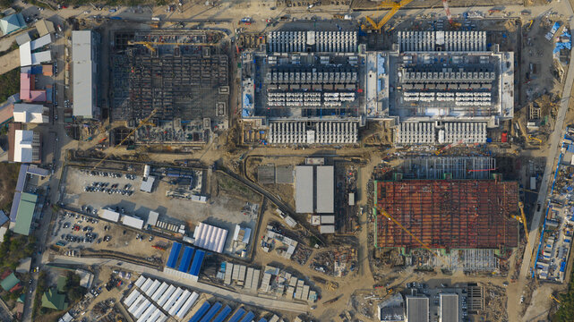 Aerial drone view of a massive hyperscale data center under construction in Chonburi, Thailand, showing cloud infrastructure, AI computing and industrial scale digital growth.