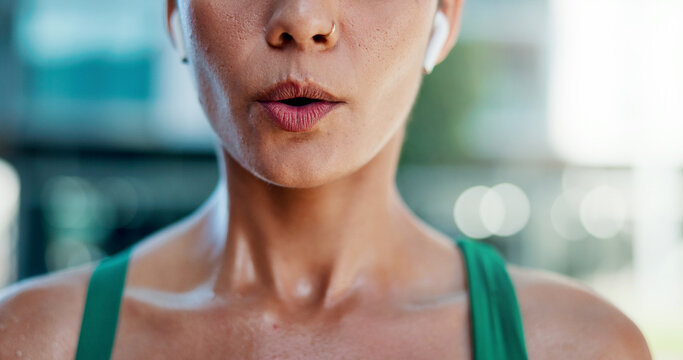 Tired, woman and breathing outdoor for fitness, exercise and exhausted from cardio training. Bokeh, fatigue and person exhale in city with burnout, overworked and recovery from endurance challenge