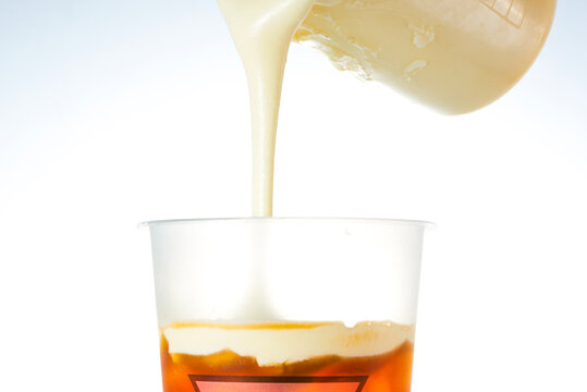 Pour the milkshake into a beverage glass.
