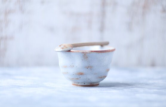 Traditional japanese ceramic on rustic wooden background. Soft focus. Copy space.