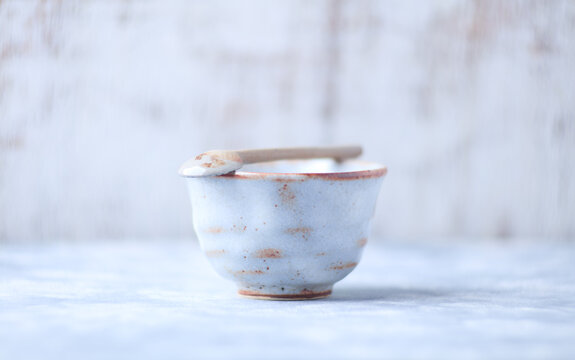 Traditional japanese ceramic on rustic wooden background. Soft focus. Copy space.