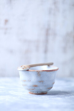 Traditional japanese ceramic on rustic wooden background. Soft focus. Copy space.