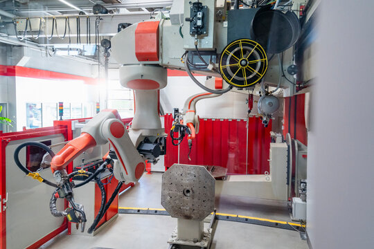 Industrial robot arm in a modern manufacturing plant