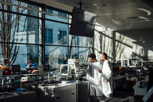 Scientist working on a screen in a bright modern laboratory