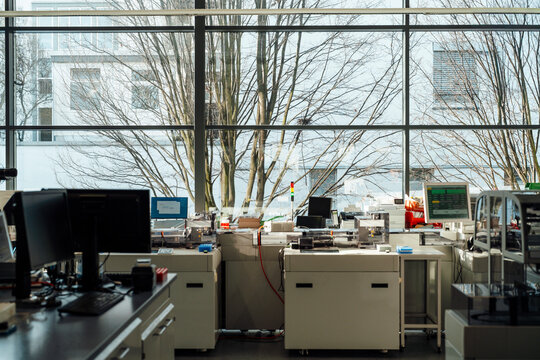 Modern empty scientific laboratory with robotic equipment indoors