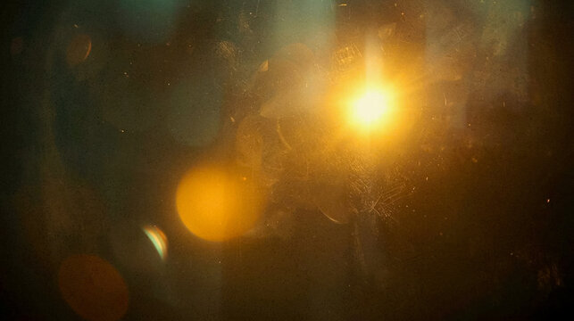 Elegant dark abstract background with glowing golden light leaks and vintage film grain texture, perfect for cinematic moody atmosphere, luxury poster design, and high-quality commercial backdrops.