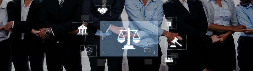 A diverse group of business professionals stands together, showcasing teamwork and collaboration while symbols of law highlight the importance of justice in a corporate setting. Trope © InfiniteFlow