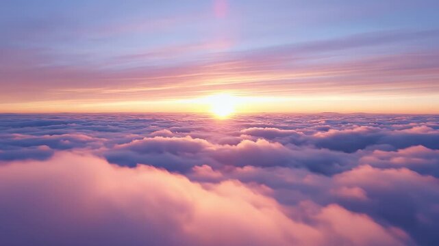 Sun sets over a sea of pink and purple clouds from an aerial perspective