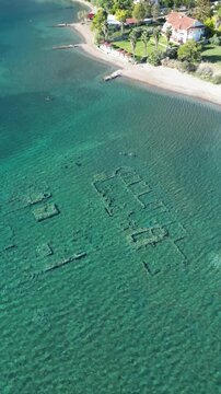 Sunken Ancient City of Epidauros in Greece from Portrait Drone View