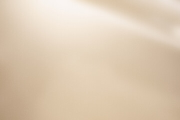 Champagne golden texture with elegant light incidence. Soft metallic background with light reflections. © gudrun