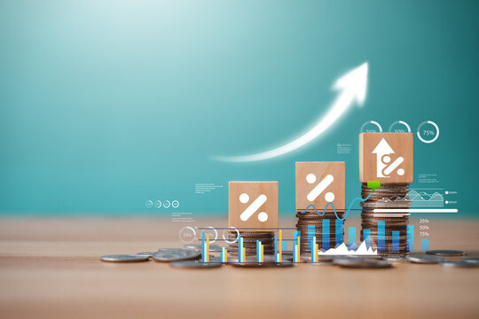 A stack of silver coins with an upward-pointing arrow; financial concepts; increasing interest rates or dividends; investing in mortgage loans.