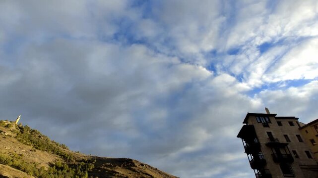 Dramatic clouds over Casas Colgadas and Sagrado Coraz&oacute;n de Jes&uacute;s monument in Cuenca