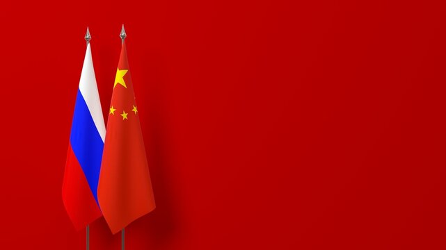 National flags of Russia and China on a red background with copy space